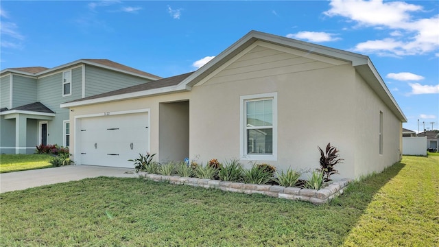 view of front of house with a garage, concrete driveway, a front lawn, and stucco siding