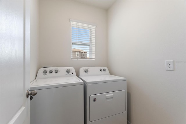 laundry area with separate washer and dryer