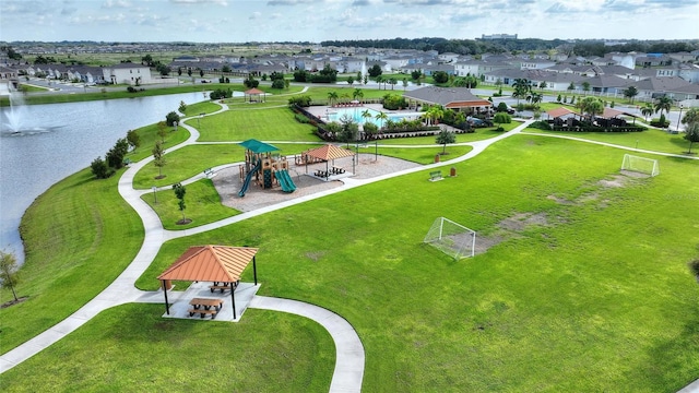 birds eye view of property featuring a water view