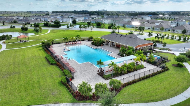 view of swimming pool featuring a patio area and a lawn