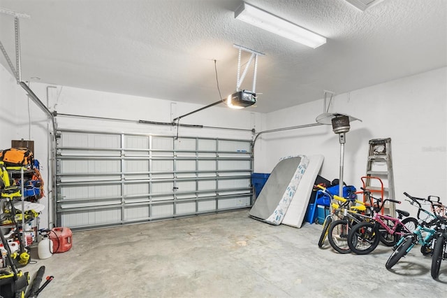 garage with a garage door opener and bike storage