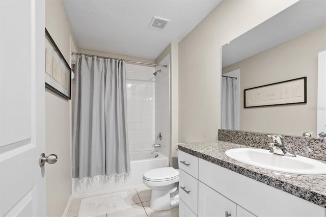 full bathroom with visible vents, toilet, shower / bath combo with shower curtain, vanity, and tile patterned floors