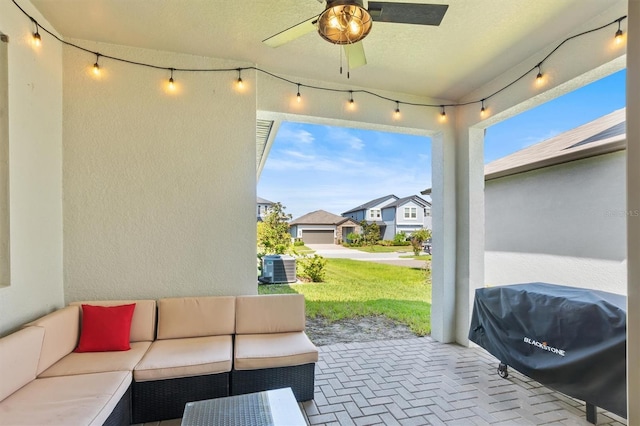 view of patio featuring ceiling fan, a residential view, an outdoor hangout area, grilling area, and central AC