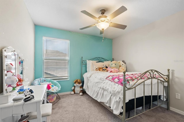 carpeted bedroom featuring a ceiling fan and baseboards