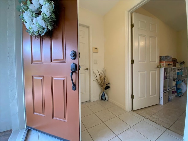 foyer with light tile patterned flooring