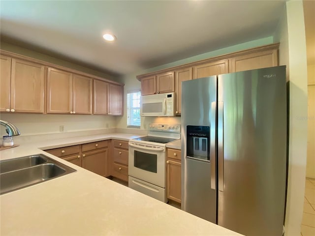 kitchen featuring sink, tile patterned floors, and white appliances