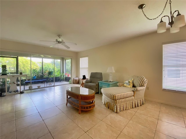 tiled living room featuring ceiling fan