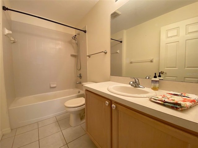 full bathroom with tiled shower / bath combo, tile patterned floors, toilet, and vanity