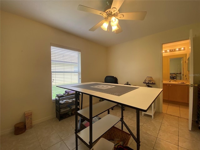 office space featuring ceiling fan and light tile patterned flooring