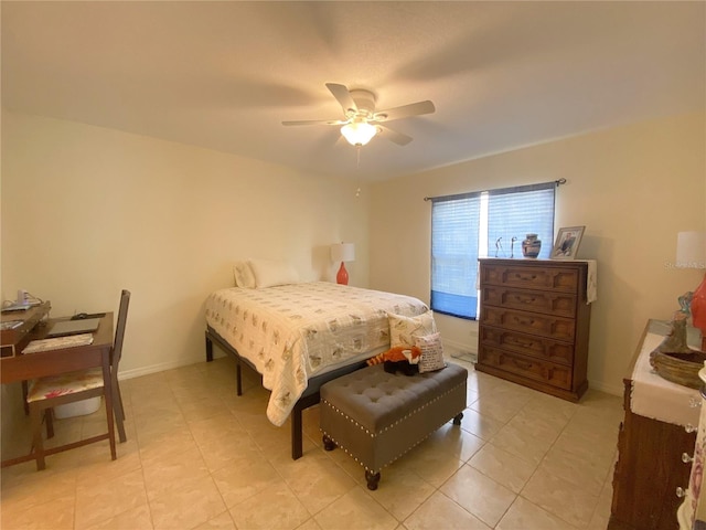 bedroom with ceiling fan and light tile patterned flooring