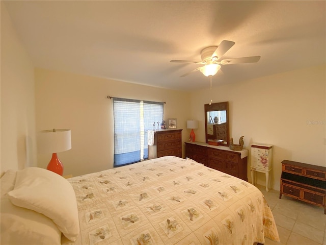 tiled bedroom with ceiling fan