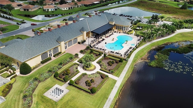 birds eye view of property featuring a water view