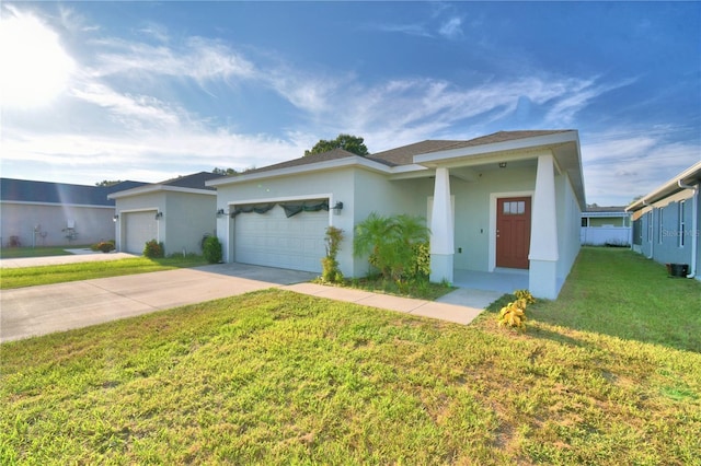 view of front of home featuring a garage and a front lawn