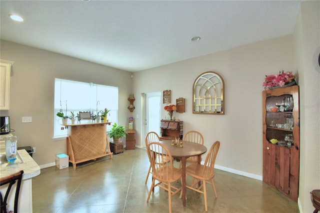 dining space featuring tile patterned flooring