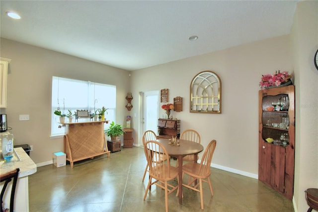 dining space with tile patterned flooring