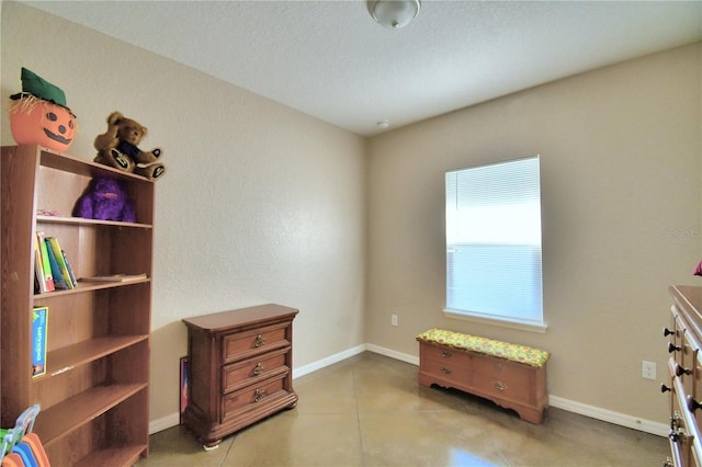 interior space featuring a textured ceiling and tile patterned flooring