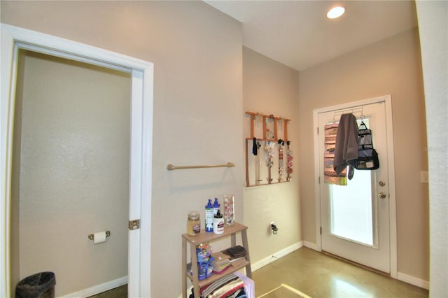 doorway to outside featuring concrete flooring