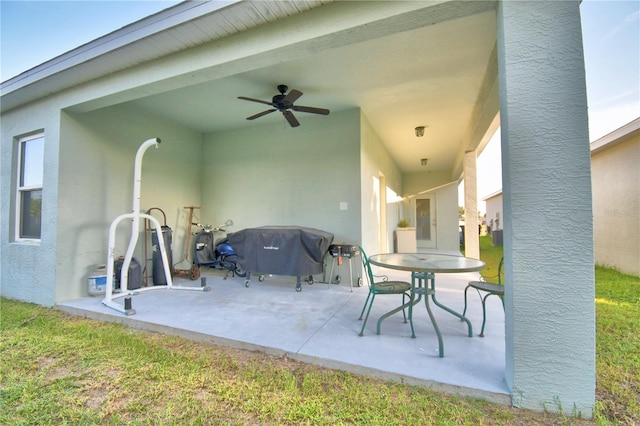 view of patio with ceiling fan and area for grilling