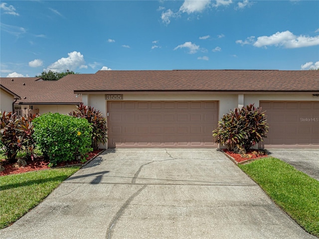 ranch-style home featuring a garage