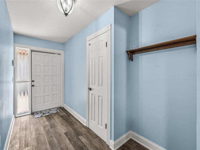 entryway with hardwood / wood-style floors