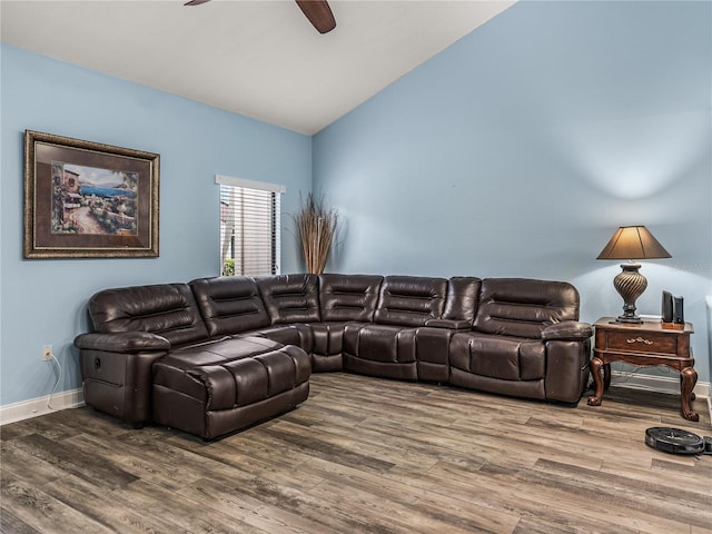 living room with hardwood / wood-style floors, ceiling fan, and lofted ceiling