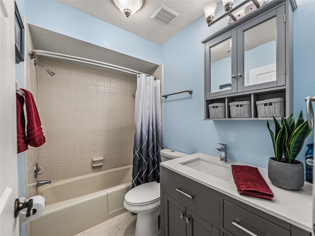 full bathroom with toilet, vanity, tile patterned floors, a textured ceiling, and shower / tub combo with curtain