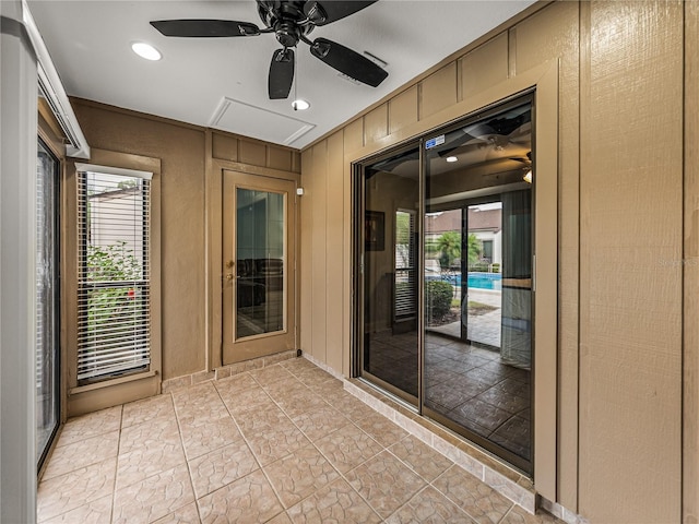 interior space with ceiling fan