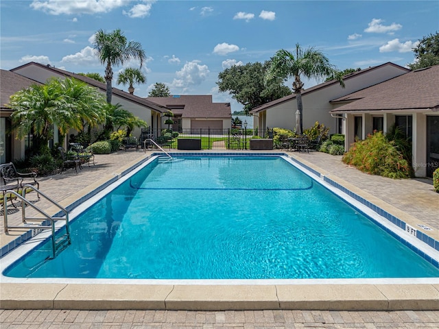 view of swimming pool with a patio area