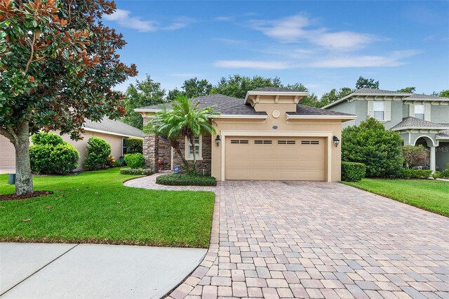 view of front facade featuring a garage and a front yard