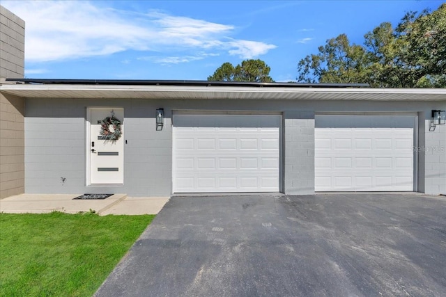 222 Rod Ln, Davenport, FL 33837 - garage featuring asphalt driveway