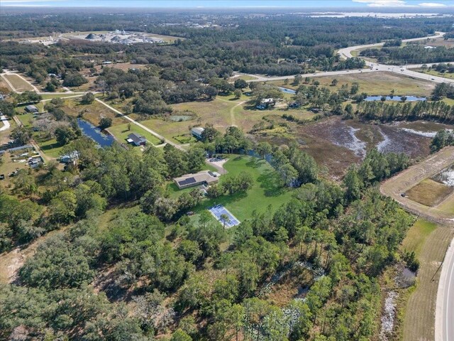 222 Rod Ln, Davenport, FL 33837 - aerial view of property and surrounding area with a large body of water and a forest