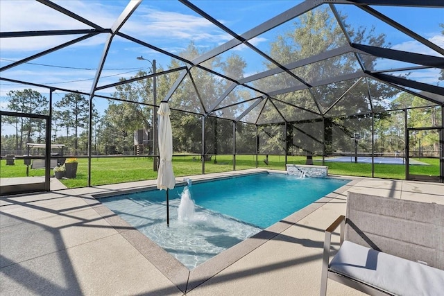 view of pool featuring pool water feature, a patio area, and a lanai