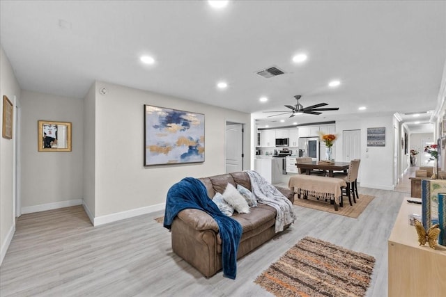 222 Rod Ln, Davenport, FL 33837 - living room with light wood-style flooring, recessed lighting, and a ceiling fan