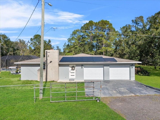 222 Rod Ln, Davenport, FL 33837 - view of front of house with roof mounted solar panels and asphalt driveway