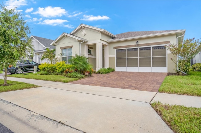 view of front facade with a front lawn and a garage