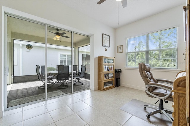 office space with ceiling fan and light tile patterned flooring