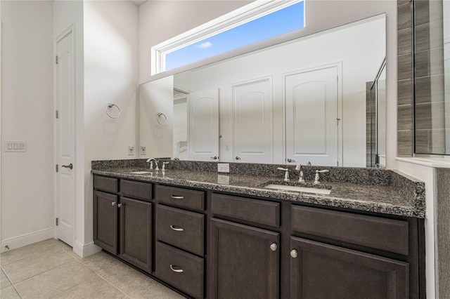 bathroom featuring tile patterned flooring and vanity