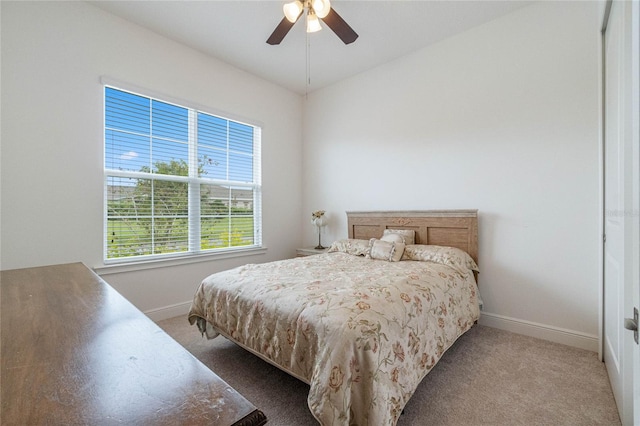 bedroom featuring ceiling fan and carpet floors