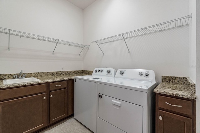 laundry room featuring sink and separate washer and dryer