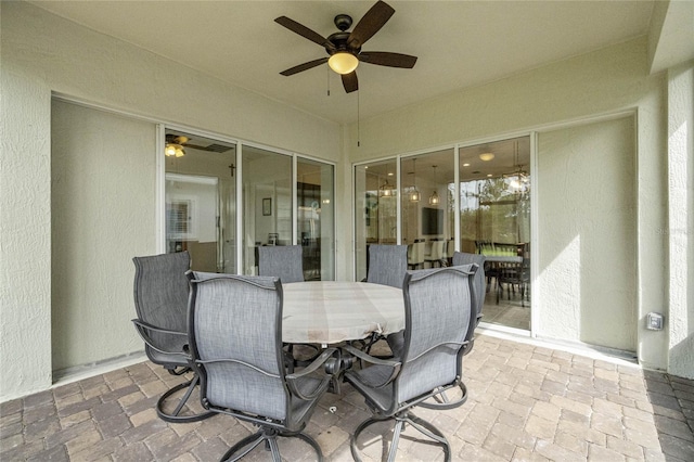 exterior space featuring ceiling fan