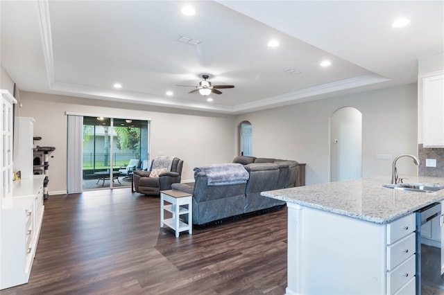 kitchen featuring dark hardwood / wood-style flooring, black dishwasher, white cabinetry, and sink