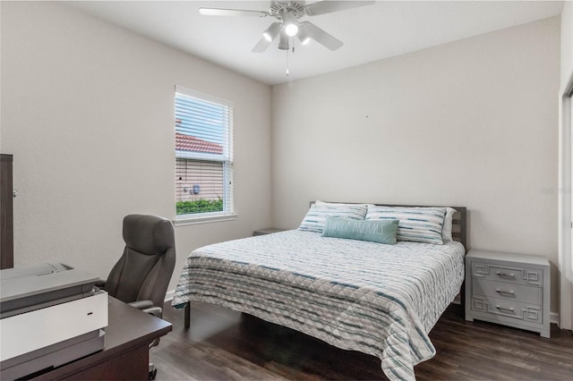 bedroom with ceiling fan and dark wood-type flooring