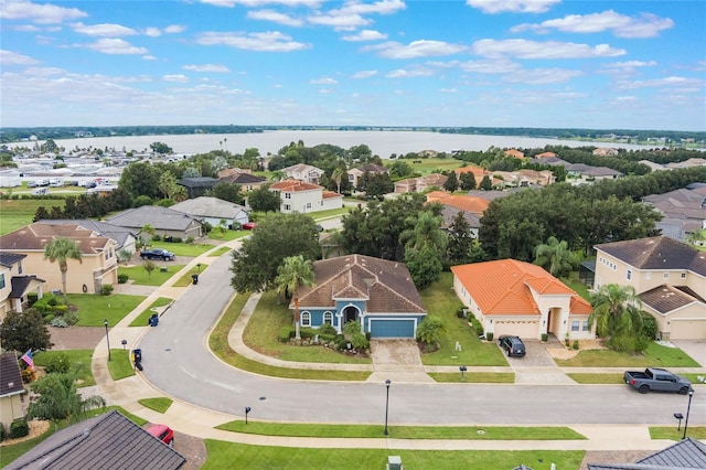 aerial view with a water view and a residential view