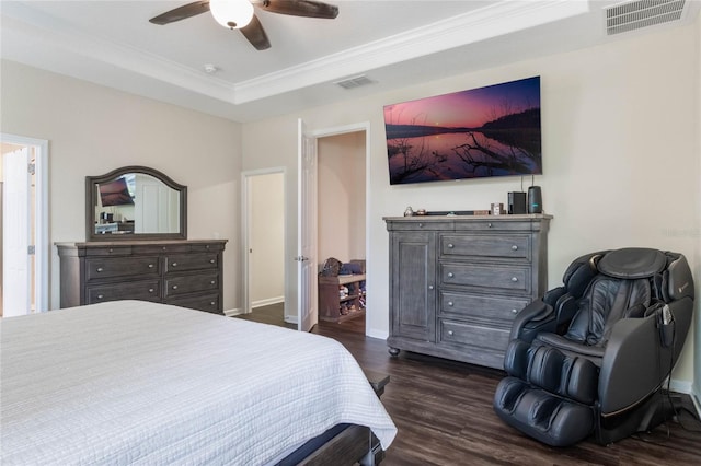 bedroom with ceiling fan, dark hardwood / wood-style floors, and crown molding