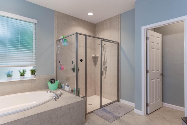 bathroom with tile patterned flooring and plus walk in shower