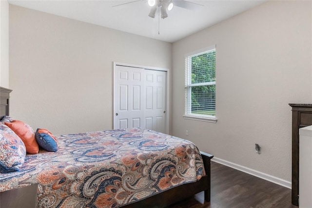 bedroom with a closet, ceiling fan, and dark hardwood / wood-style flooring