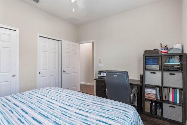 bedroom featuring ceiling fan and dark hardwood / wood-style flooring