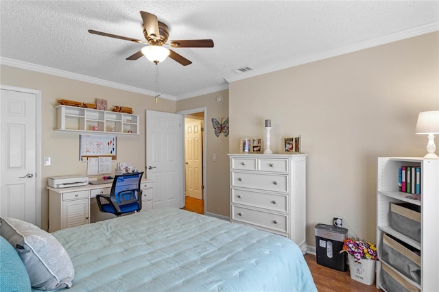 bedroom featuring ceiling fan, light hardwood / wood-style flooring, ornamental molding, and a textured ceiling