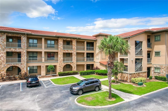 902 Charo Pkwy Unit 624, Davenport, FL 33897 - view of apartment building / complex featuring uncovered parking