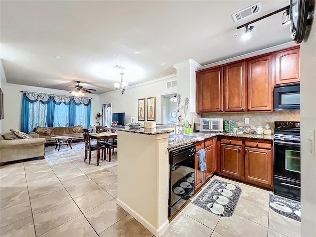 kitchen with ceiling fan with notable chandelier, crown molding, light tile patterned floors, kitchen peninsula, and black appliances